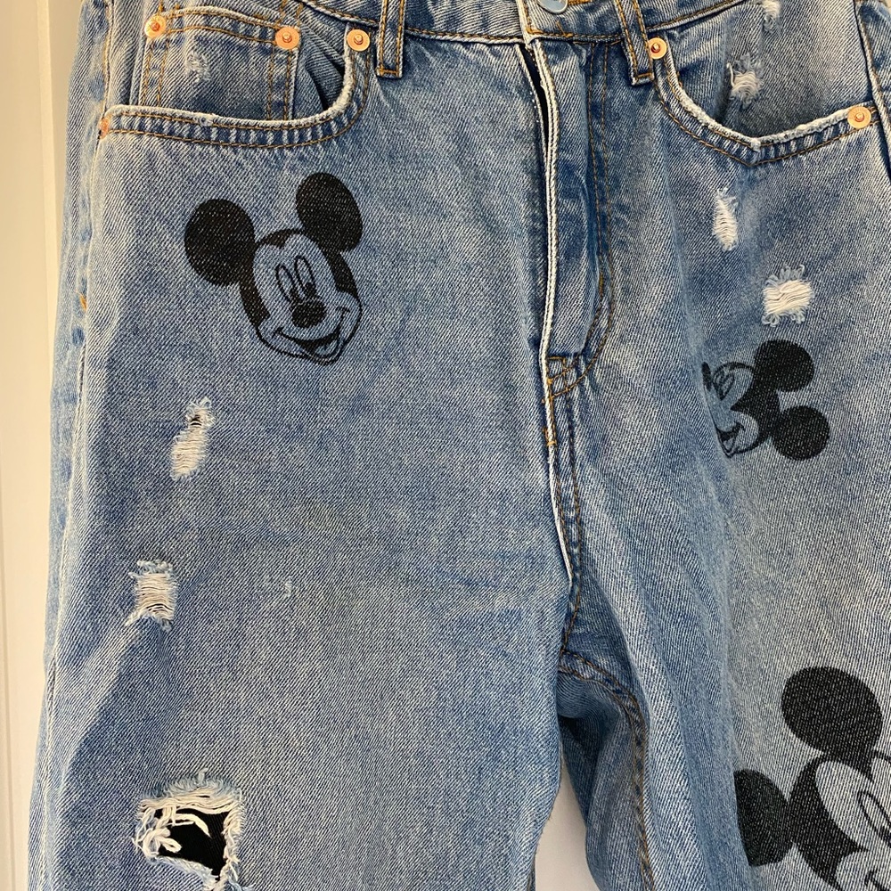 H&M x Disney distressed Mickey Mouse jeans